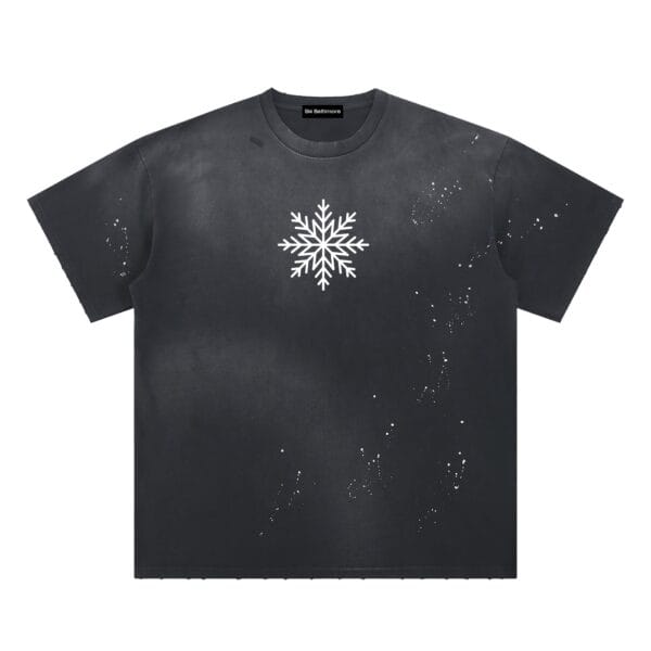 Splatter Tee in a relaxed fit, showing the worn-in sun-fade wash and paint splatter texture