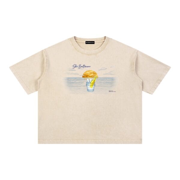 The Horizon Tee in Light Apricot, a 100% cotton t-shirt with a coastal sunset-over-the-water print