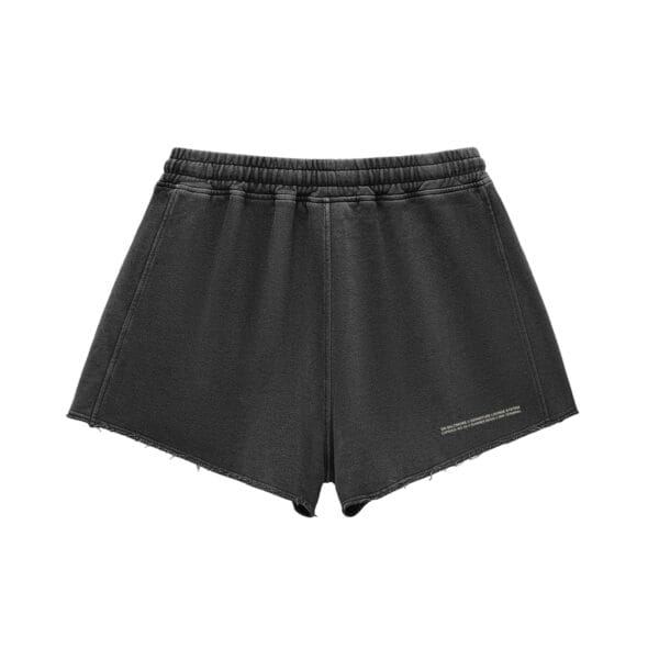 Alternate view of The Runway Short in black, showing the distressed detailing and snow-washed finish