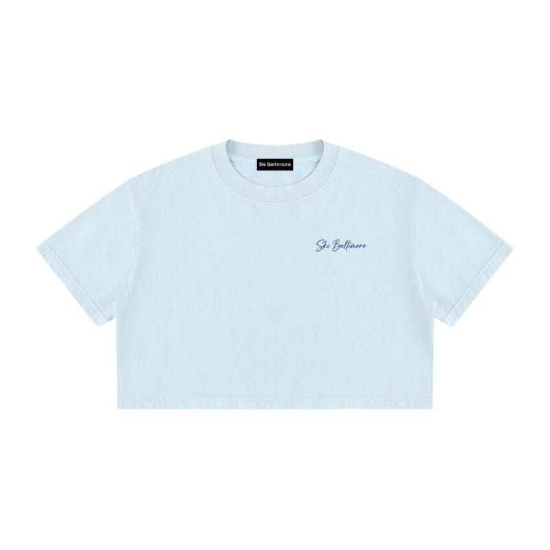 The Estate Crop T-Shirt, a cropped cotton tee with an architectural blueprint and tropical watercolor print